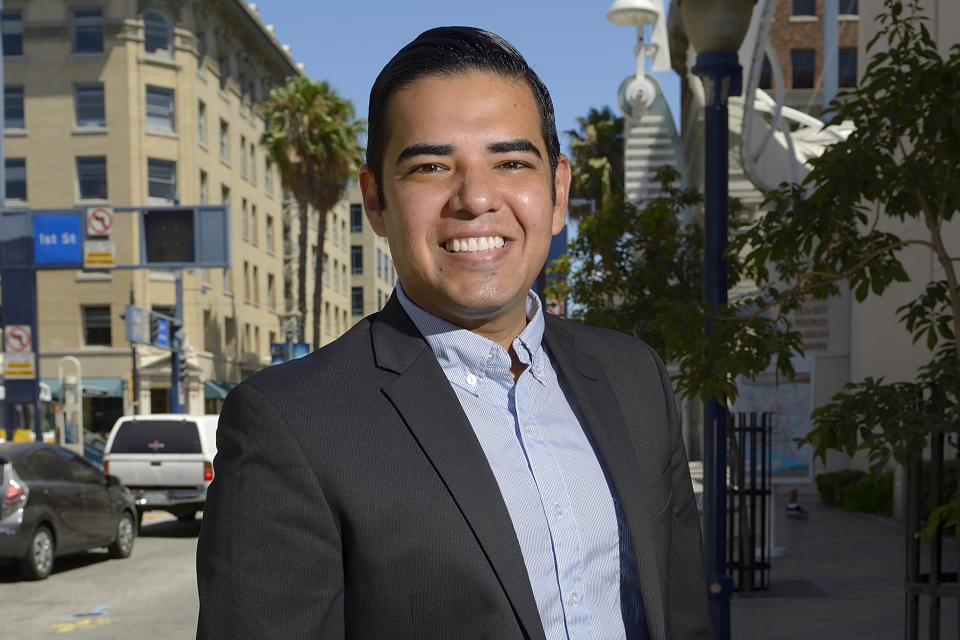 Long Beach, Calif., Mayor-elect Robert Garcia poses on Pine Avenue after his election in Long Beach on July 11, 2014. The potential ascendancy of Sen. Kamala Harris to the vice presidency next year has kicked off widespread speculation about who might replace her if Democrats seize the White House. California Gov. Gavin Newsom is already being lobbied by hopefuls and numerous names are emerging in the early speculation. Garcia is the city's first openly gay mayor. (Jeff Gritchen/The Orange County Register via AP)