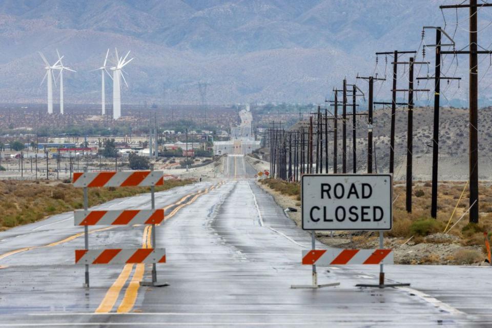 Indian Canyon Drive in Palm Springs, California, was closed where it crosses a usually dry wash section of the Whitewater River as Tropical Storm Hilary moved closer to the area on Sunday.