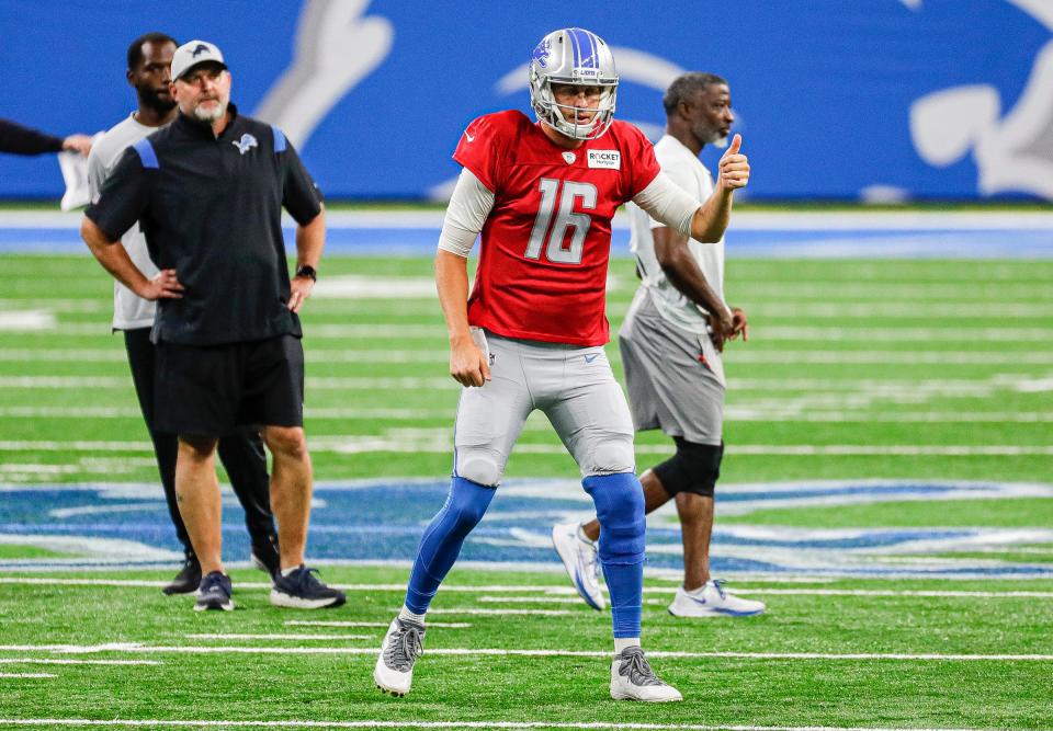 Lions quarterback Jared Goff signals teammates during open practice at Family Fest at Ford Field on Saturday, August 6, 2022.