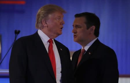 Republican U.S. presidential candidate businessman Donald Trump and rival candidate Senator Ted Cruz (R) cross paths during a break at the Fox Business Network Republican presidential candidates debate in North Charleston, South Carolina January 14, 2016. REUTERS/Chris Keane