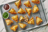 Need a reason to throw a party? Folding samosas is an ideal group activity as extra hands can be useful, so invite friends or family to join you. Just be sure to provide <a href="https://www.bonappetit.com/dish/cocktail?mbid=synd_yahoo_rss" rel="nofollow noopener" target="_blank" data-ylk="slk:cocktails;elm:context_link;itc:0" class="link ">cocktails</a>. <a href="https://www.bonappetit.com/recipe/ammas-samosas?mbid=synd_yahoo_rss" rel="nofollow noopener" target="_blank" data-ylk="slk:See recipe.;elm:context_link;itc:0" class="link ">See recipe.</a>