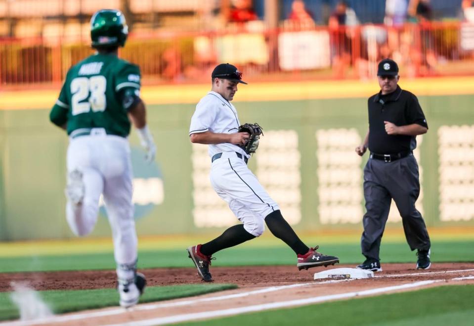 South Carolina first baseman Kevin Madden (50) forces out Charlotte 49ers infielder Josh Madole at Founders Park on Tuesday in the Gamecocks’ final home game of the season. Charlotte won 8-3.