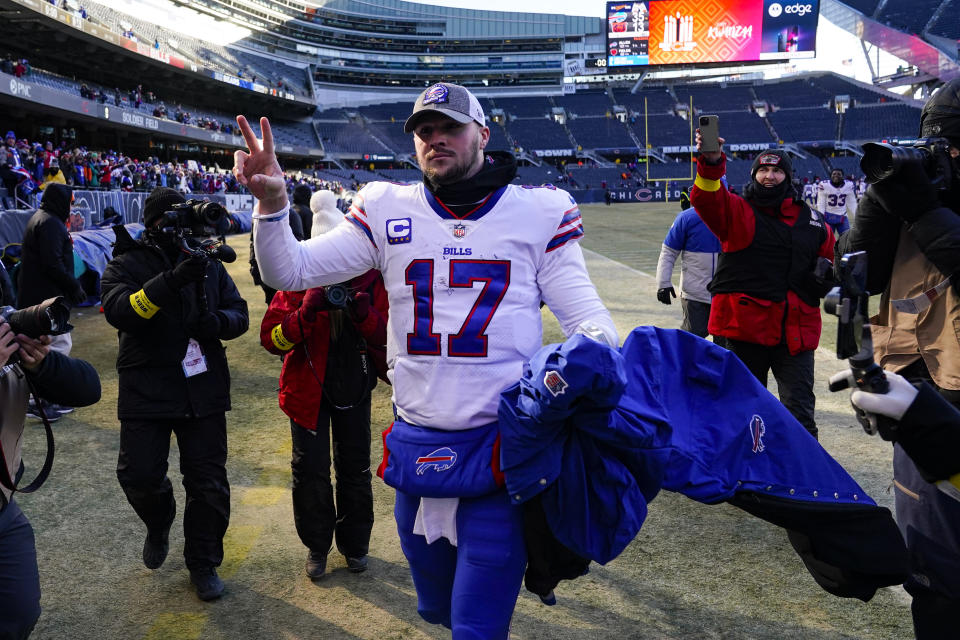 Buffalo Bills quarterback Josh Allen (17) waves to fans as he leaves the field following an NFL football game against the Chicago Bears in Chicago, Saturday, Dec. 24, 2022. The Bills defeated the Bears 35-13.(AP Photo/Charles Rex Arbogast)