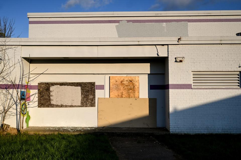 A boarded up entrance to the former Maple Grove School, now owned by Kingdom Life Church, on Tuesday, April 25, 2023, in Lansing.