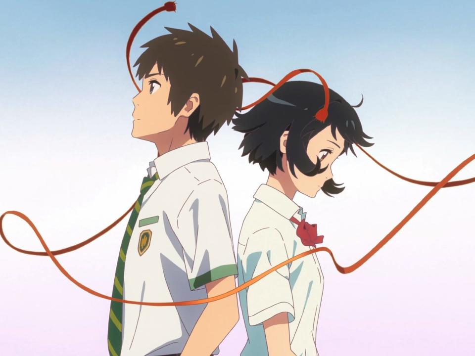 taki and mitsuha in makoto shinkai's your name. they are a young boy and girl, both wearing school uniforms, standing back to back and not looking at each other. around them, mitsuha's red hair ribbon floats in the air, surrounding them as if signifying a thread of fate that has brought them together.