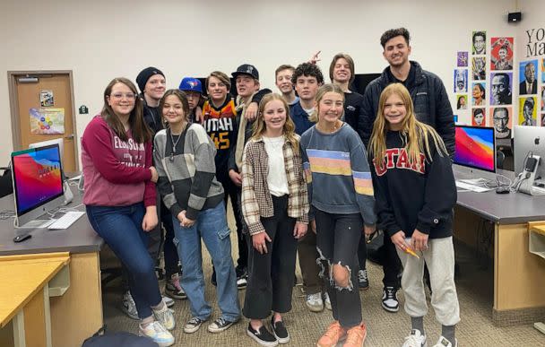 PHOTO: Jones smiles for a photo with some of his middle school students at Rocky Mountain Middle School in Heber City, Utah. (Courtesy of Garrett Jones)