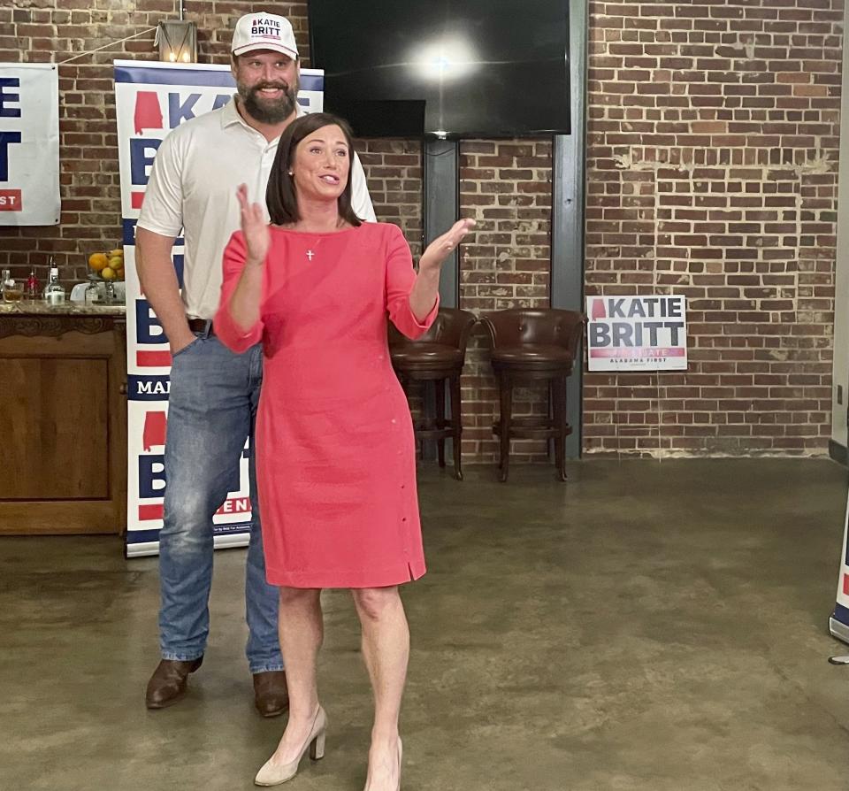 Republican Katie Britt and her husband Wesley Britt greet supporters in Cullman, Ala., on May 23, 2022, ahead of the U.S. Senate primary in Alabama. Britt is one of several Republicans seeking the GOP nomination for the seat being vacated by retiring U.S. Sen. Richard Shelby. (AP Photo/Kim Chandler)