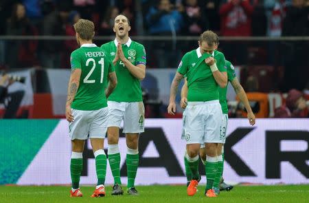 Football - Poland v Republic of Ireland - UEFA Euro 2016 Qualifying Group D - Stadion Narodowy, Warsaw, Poland - 11/10/15 Ireland's John O'Shea, Jeff Hendrick and Glenn Whelan look dejected after Poland's Robert Lewandowski (not pictured) scores their second goal Action Images via Reuters / Adam Holt