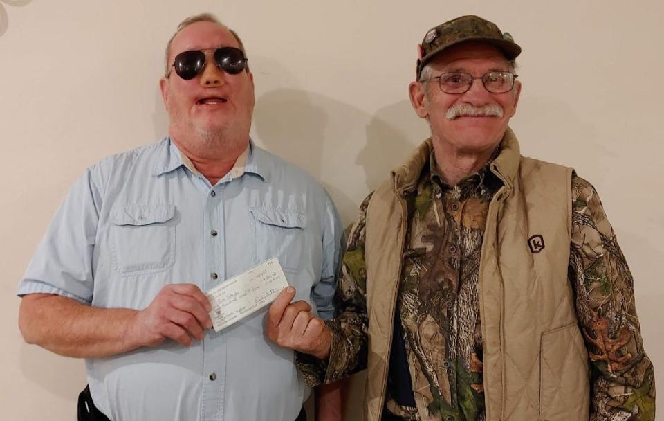 Bob Schuh (from left) accepts a $300 check from Al Klingeisen, president of Friends of the Branch River, which will be used for the purchase of wood and supplies for the birdhouse project. Many of these bluebird houses will be used for a children’s birdhouse painting event that will be held later this spring at Woodland Dunes Nature Center.