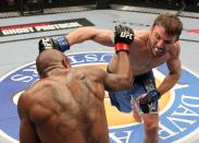 Stephen Bass (R) and Marcus Brimmage (L) throw punches during The Ultimate Fighter 14 Finale at the Pearl Theatre at the Palms Hotel and Casino on December 3, 2011 in Las Vegas, Nevada. (Photo by Josh Hedges/Zuffa LLC/Zuffa LLC via Getty Images)