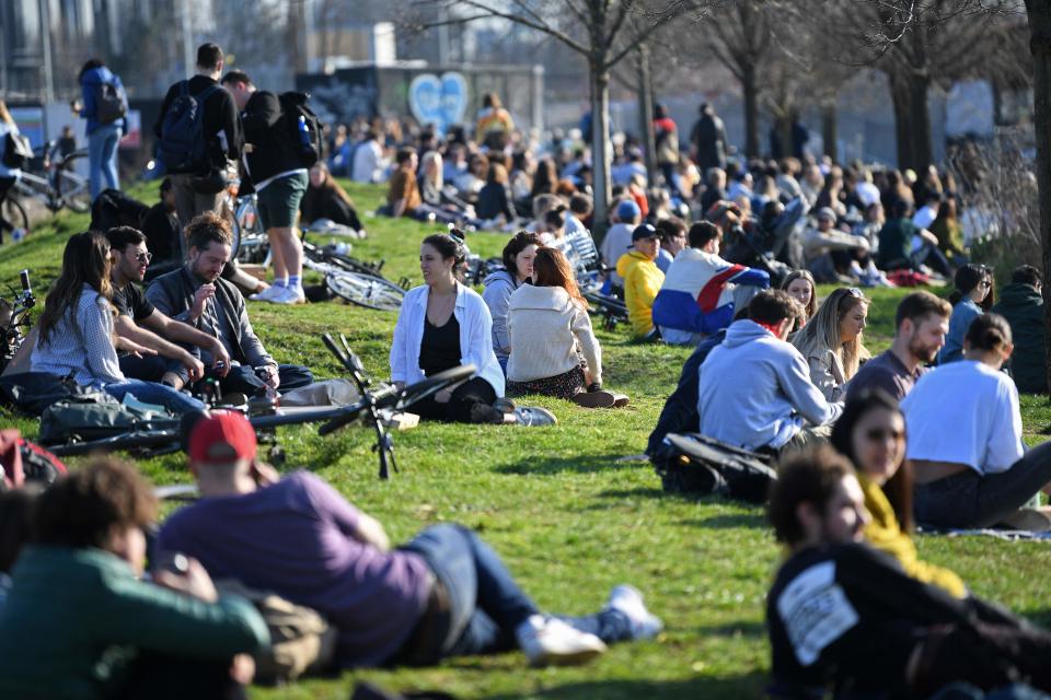 People gather in Hackney Wick to bask in the sunAFP via Getty Images