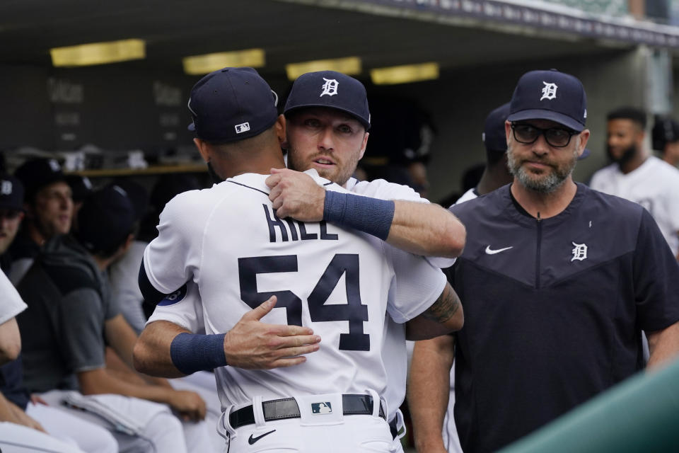 Detroit Tigers' Kody Clemens hugs teammate Derek Hill before the first inning of the second baseball game of a doubleheader against the Minnesota Twins, Tuesday, May 31, 2022, in Detroit. Clemens was making his debut with the Tigers in the major leagues. (AP Photo/Carlos Osorio)