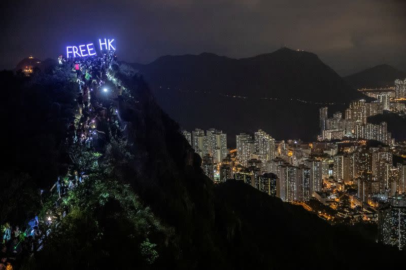 FILE PHOTO: Anti-government protesters gather at Lion Rock, in Hong Kong