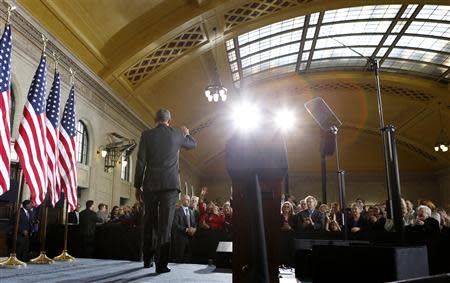 U.S. President Barack Obama waves after speaking at Union Depot in St. Paul, Minnesota February 26, 2014. REUTERS/Kevin Lamarque