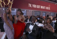 In this video grab issued Sunday, Sept. 19, 2021, by the Television Academy, Susan Kelechi Watson, left, and Mandy Moore, second from left, perform during the opening number of the Primetime Emmy Awards. (Television Academy via AP)