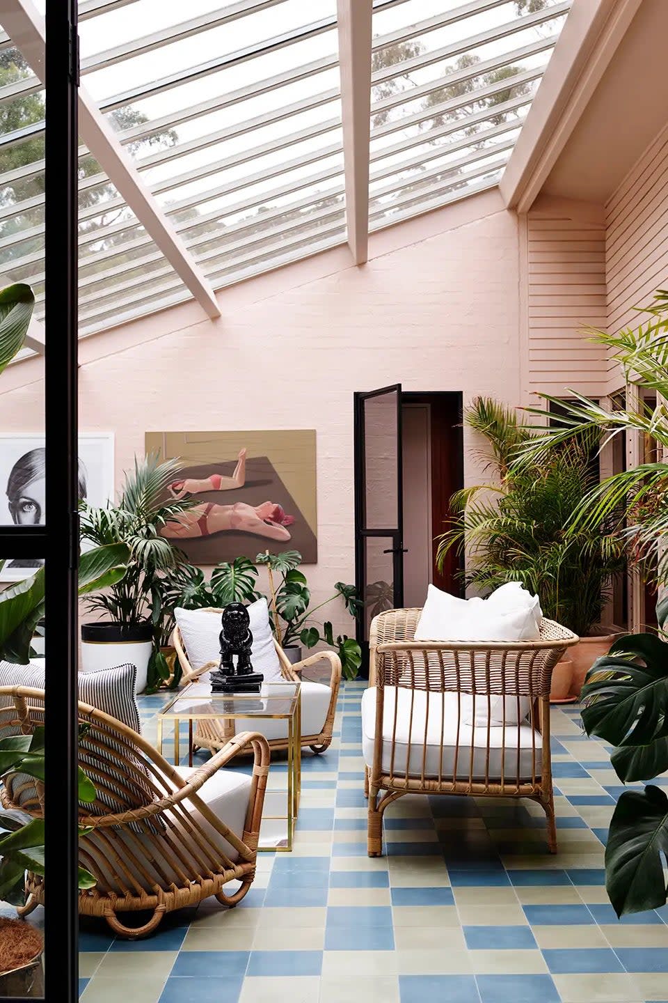 pink sunroom with slanted skylight