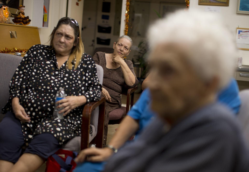 Geri Vitale, center, watches the Presidential debate with fellow residents of an independent senior apartment complex, Tuesday, Oct. 16, 2012, in Boulder City, Nev. (AP Photo/Julie Jacobson)