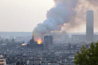 FILE - In this file photo dated Monday, April 15, 2019, Notre Dame cathedral is burning in Paris. After more than two-years of work to stabilize and protect it after the shocking fire that tore through its roof and knocked down its spire, France’s Notre Dame Cathedral is finally stable and secure enough for artisans to start rebuilding it, according to a government statement Saturday Sept. 18, 2021. (AP Photo/Rafael Yaghobzadeh, FILE)