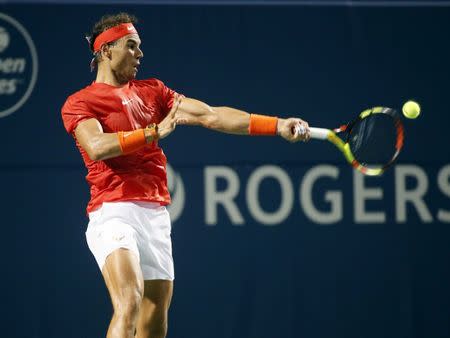 Aug 8, 2018; Toronto, Ontario, Canada; Rafael Nadal (ESP) returns a ball to Benoit Paire (not pictured) in the Rogers Cup tennis tournament at Aviva Centre. John E. Sokolowski-USA TODAY Sports