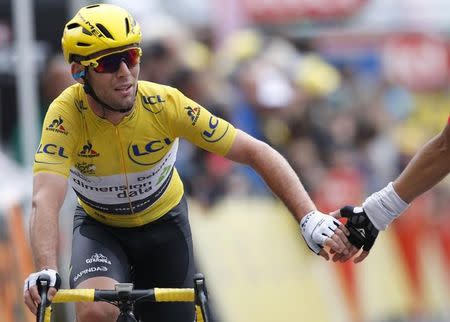 Cycling - Tour de France cycling race - The 183-km (113 miles) Stage 2 from Saint-Lo to Cherbourg-en-Cotentin, France - 03/07/2016 - Yellow jersey leader Team Dimension Data rider Mark Cavendish of Britain reacts on the finish line. REUTERS/Jean-Paul Pelissier