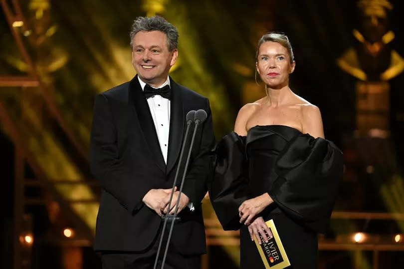 Michael Sheen and Anna Maxwell Martin presenting on stage during The Olivier Awards 2024