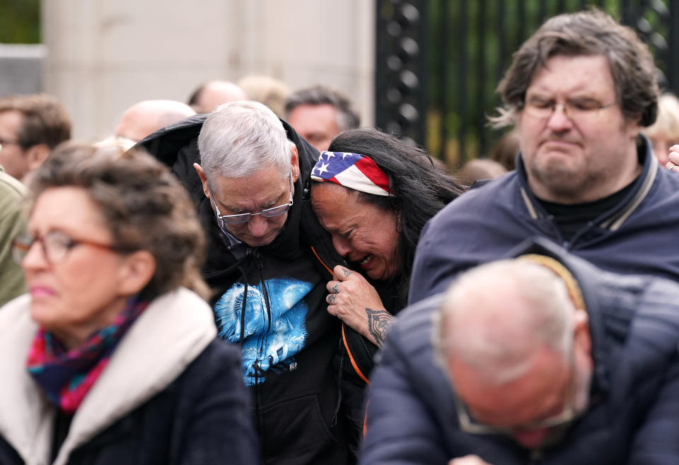 Members of the public on the Mall listen to the State Funeral of Queen Elizabeth II, held at Westminster Abbey, London. Picture date: Monday September 19, 2022.