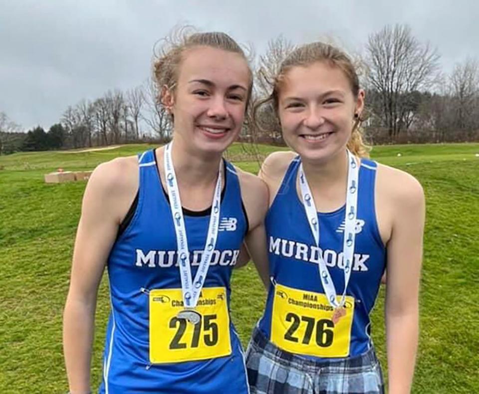 Murdock girls cross-country teammates Avery Murphy, left, and Lillian Skawinski placed second and fourth, respectively, at the MIAA Division 3C state qualifier, Sunday, at Gardner Municipal Golf Course.