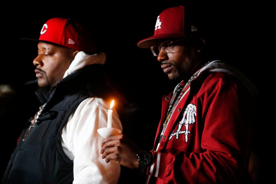 Jamal Dupree and Michael Cutrer, Tyre Nichol’s brothers, listen to their mother speak during a candlelight vigil for Nichols held at the site where he was beaten to death by Memphis Police Department officers on the one year anniversary of his death in Memphis, Tenn., on Sunday, January 7, 2024.