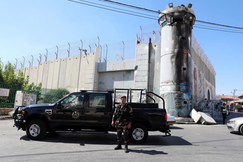 Palestinian police on patrol where US president Joe Biden’s convoy is expected to pass in the West Bank city of Bethlehem, 14 July 2022 (EPA)