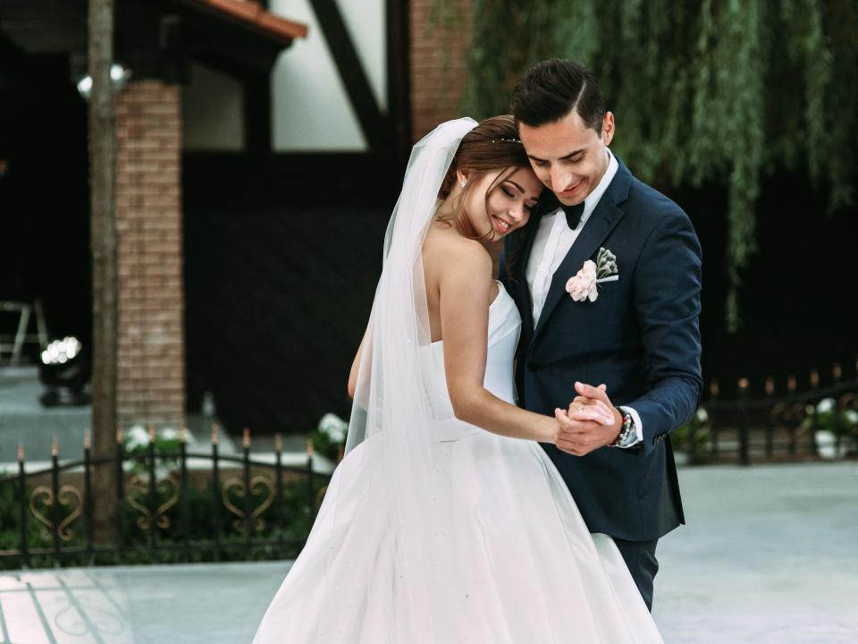 bride and groom first dance outside