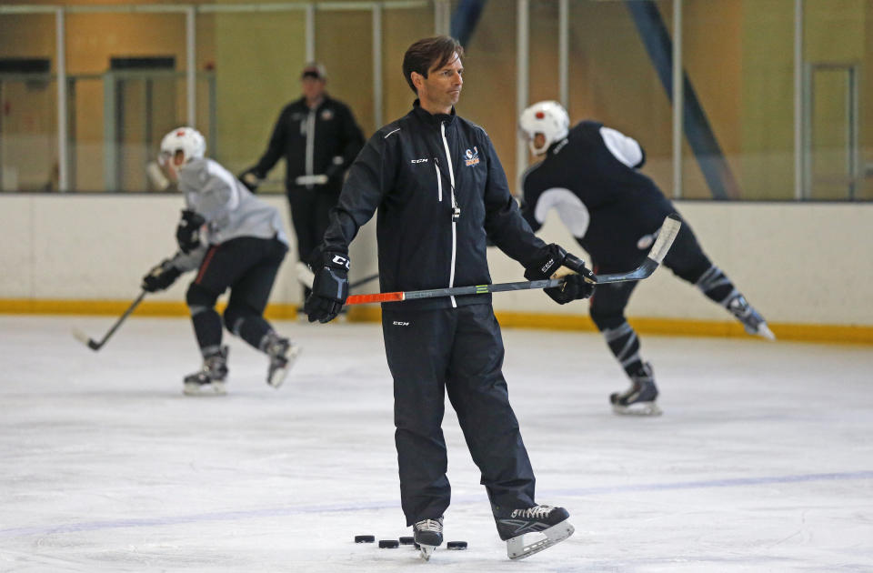 FILE - In this Oct. 8, 2015, file photo, San Diego Gulls coach Dallas Eakins watches during hockey practice in San Diego. Dallas Eakins is the Anaheim Ducks' new coach. The Ducks announced the move Monday, June 17, 2019, filling the NHL's last head coaching vacancy with the veteran coach of their AHL affiliate in San Diego. (AP Photo/Lenny Ignelzi, File)