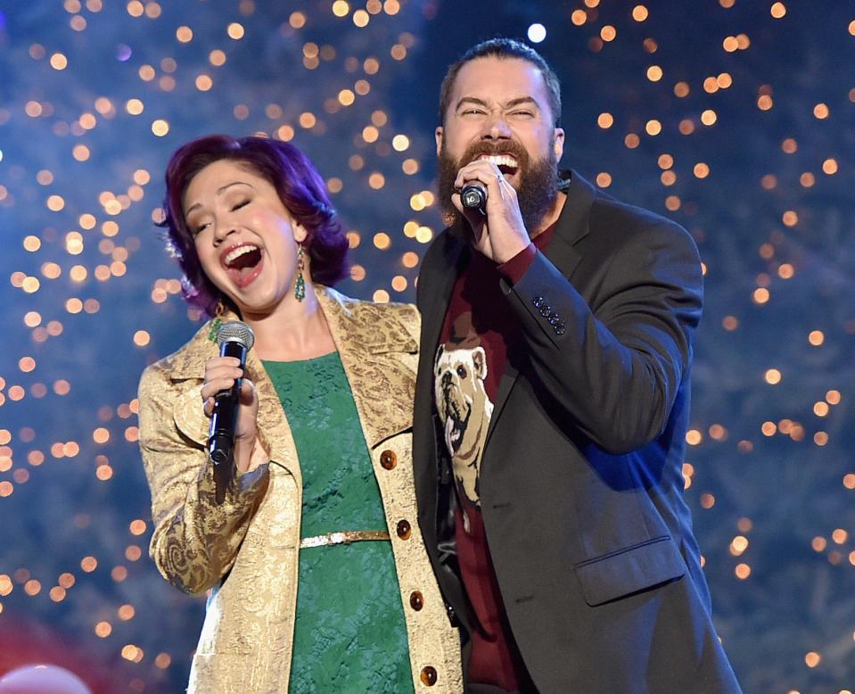 Singers Diana DeGarmo, , left, and Ace Young perform onstage during the 2015 Hollywood Christmas Parade.