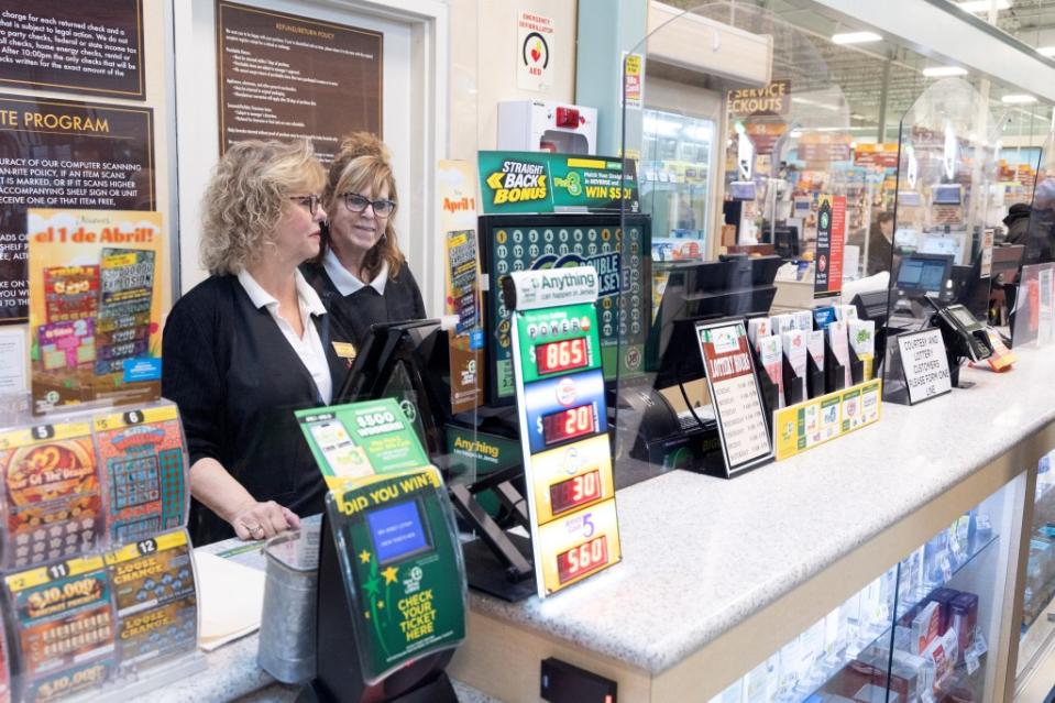 Customer service desk at Shop Rite in Neptune, NJ, where the winning Mega Millions Lottery ticket was sold, with two women standing behind the counter. Aristide Economopoulos