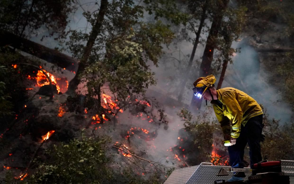 Boulder Creek firefighters tackling the CZU August Lightning Complex fir - AP