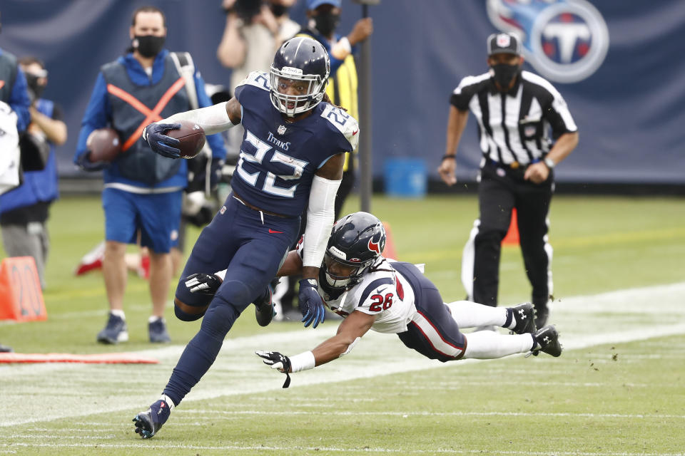 Tennessee Titans running back Derrick Henry (22) gets past Houston Texans cornerback Vernon Hargreaves III (26) as Henry runs for 53 yards in overtime of an NFL football game Sunday, Oct. 18, 2020, in Nashville, Tenn. The Titans won in overtime 42-36. (AP Photo/Wade Payne)