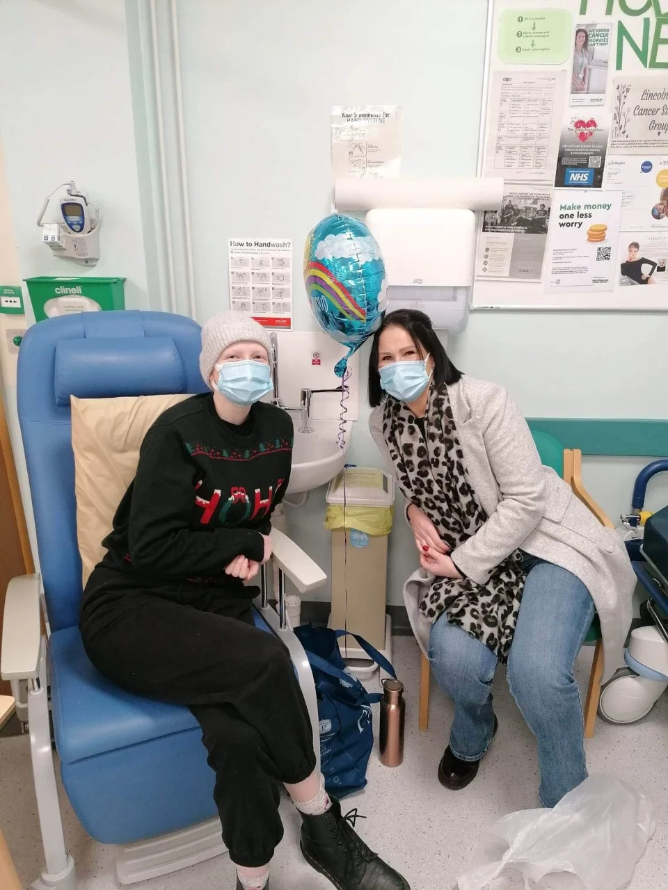 Lucy Wiswould-Green with mum Melissa at her last chemotherapy session. (University of Salford/SWNS)