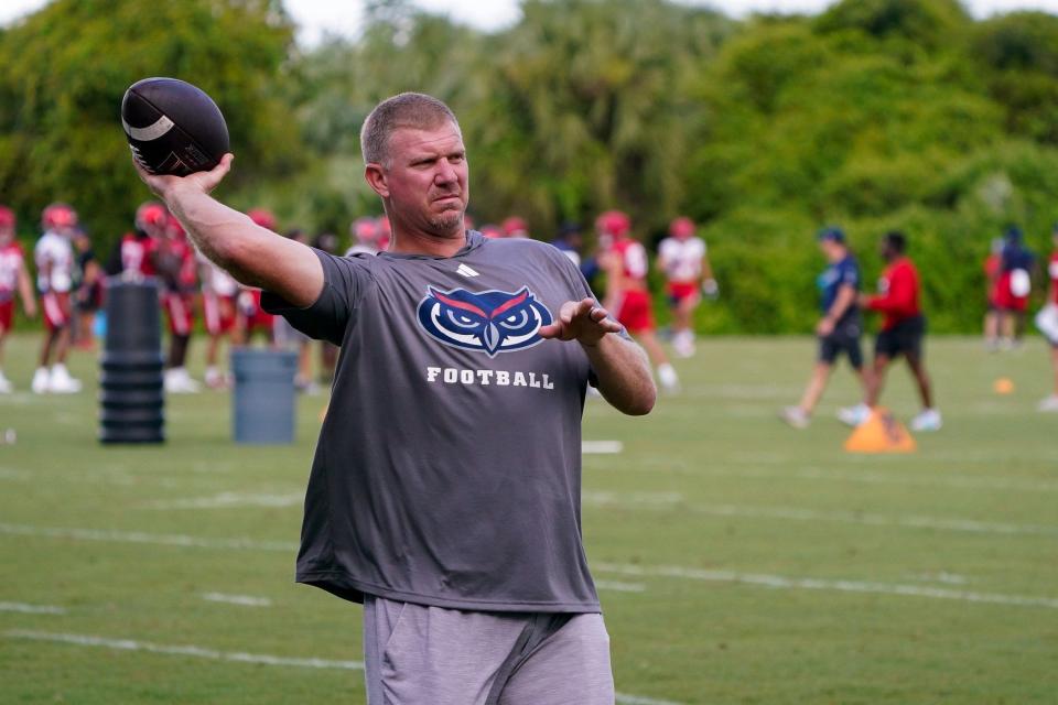 Florida Atlantic offensive coordinator Charlie Frye works with the quarterbacks during practice at the Schmidt Family Complex, Thursday, August 3, 2023 in Boca Raton.