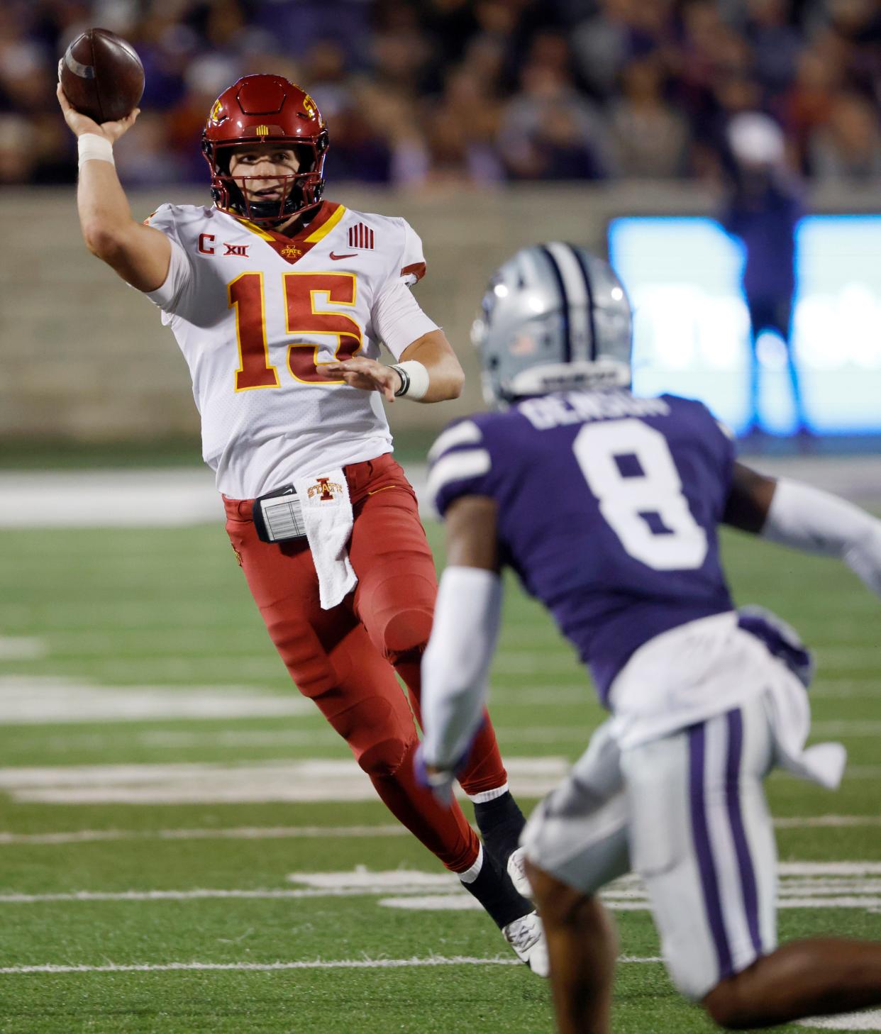 Iowa State quarterback Brock Purdy (15) passes the ball downfield as Kansas State defensive back Tee Denson (8) defends during the second quarter of an NCAA football game on Saturday, Oct. 16, 2021, at Bill Snyder Family Football Stadium in Manhattan, Kansas.