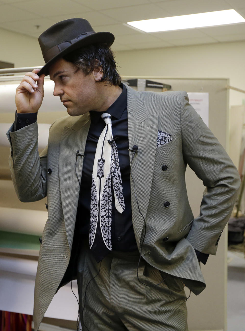 Mike Piazza, former MLB baseball player, strikes a pose as he is fitted for his costume for his role in "Slaughter on Tenth Avenue" at the Miami City Ballet, Tuesday, April 16, 2013, in Miami Beach, Fla. Piazza will play a gangster in the ballet on May 3. He will say a few lines and then watch the rest of the performance from a seat onstage. Piazza says his turn with the troupe is his gift to his 6-year-old daughter, a student at Miami City Ballet School. (AP Photo/Lynne Sladky)