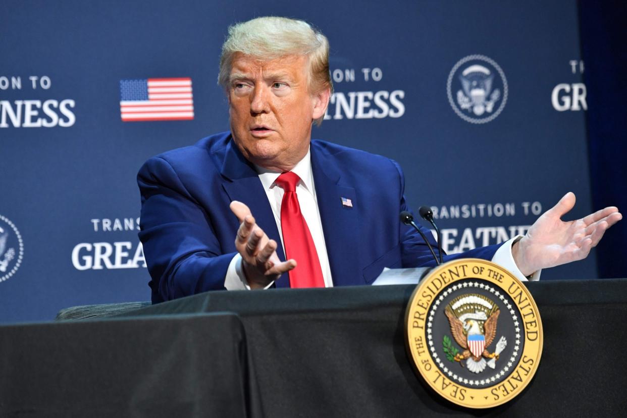 Donald Trump gestures as he speaks during a roundtable with faith leaders and small business owners at Gateway Church Dallas Campus in Dallas, Texas: AFP via Getty Images