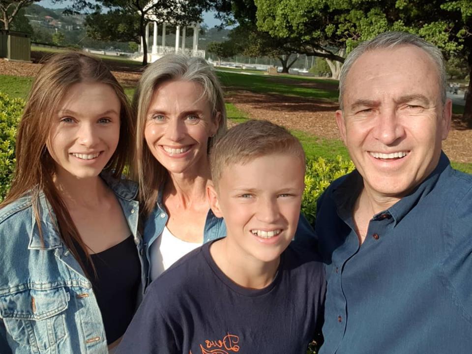 Sunrise’s Mark Beretta with his wife and two children.