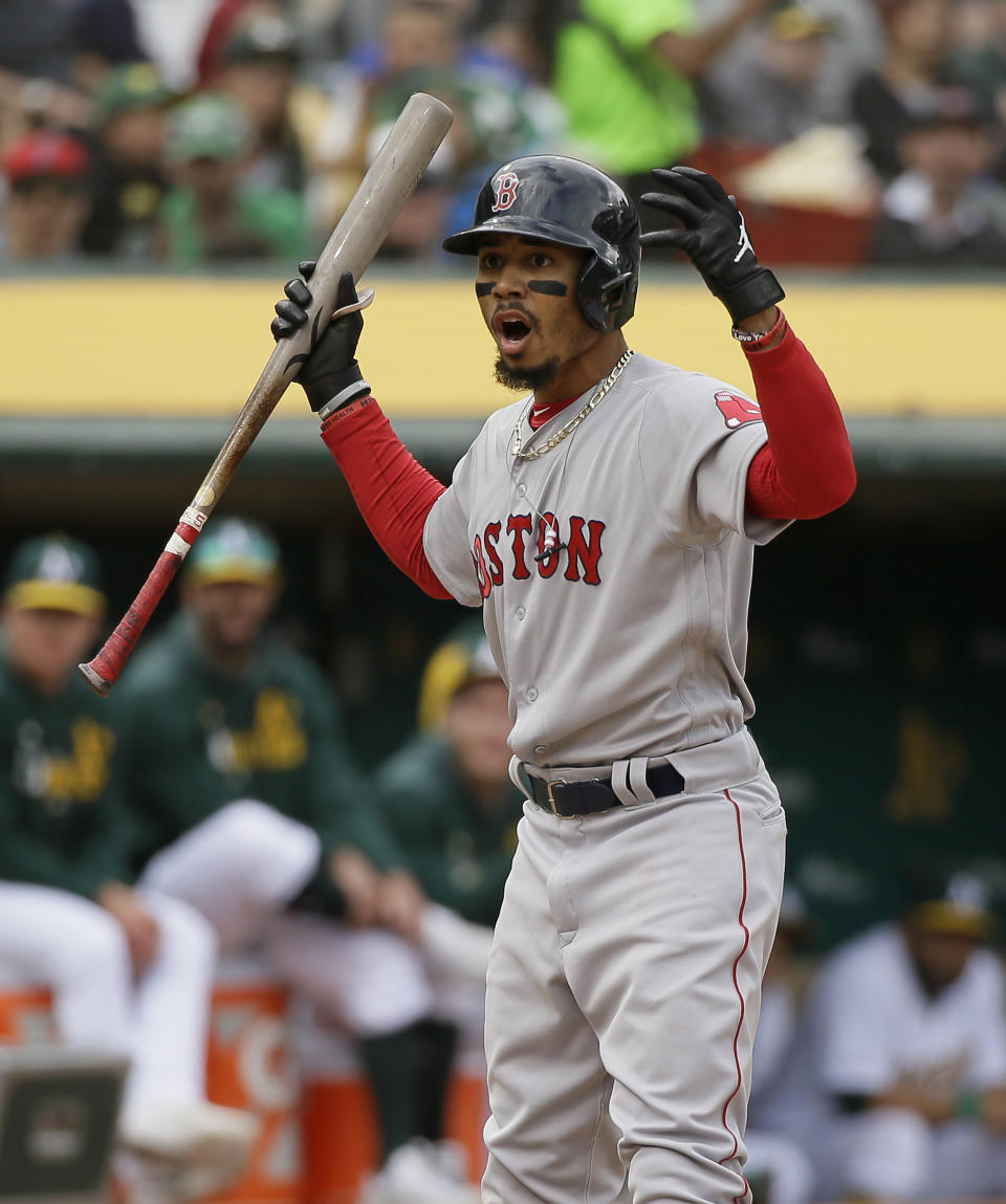 Boston Red Sox's Mookie Betts reacts after striking out looking in the sixth inning of a baseball game against the Oakland Athletics Thursday, April 4, 2019, in Oakland, Calif. (AP Photo/Eric Risberg)