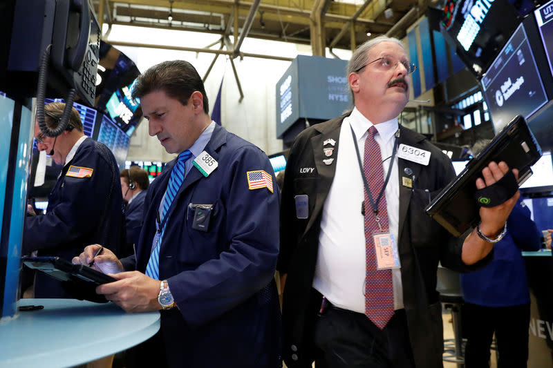 Traders work on the floor of the New York Stock Exchange (NYSE) in New York, U.S., September 5, 2017. REUTERS/Brendan McDermid