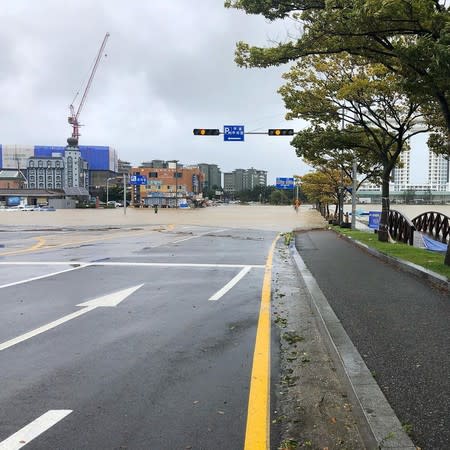 A road is partially submerged in water after Typhoon Mitag brought heavy rain and flood to Gangneung