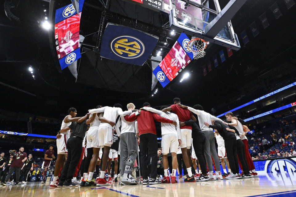 Alabama players huddle before an NCAA college basketball game against Mississippi State in the quarterfinals of the Southeastern Conference Tournament, Friday, March 10, 2023, in Nashville, Tenn. (AP Photo/John Amis)