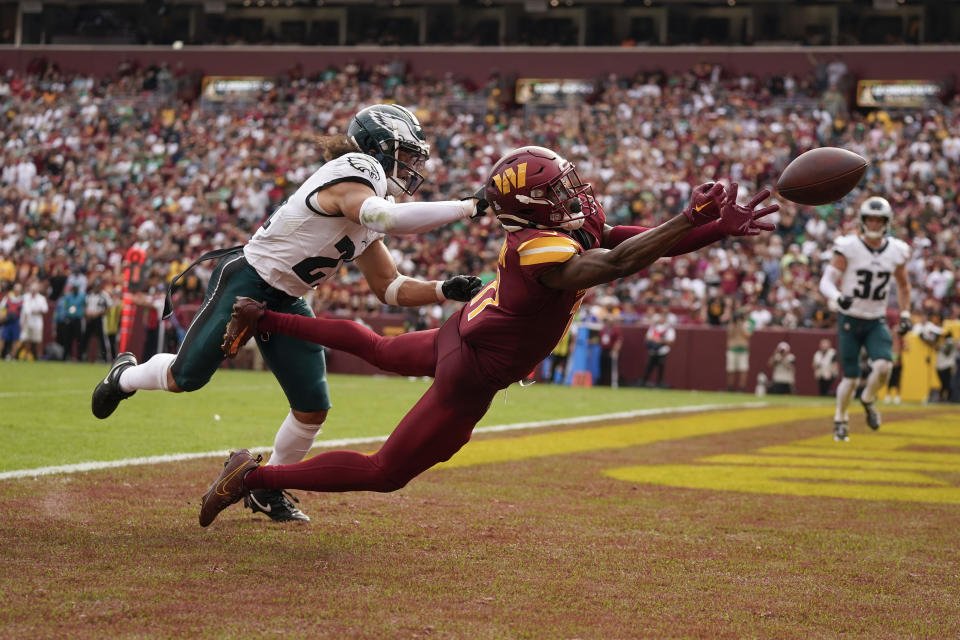 Washington Commanders wide receiver Terry McLaurin (17) misses making a catch in the endzone while being covered by Philadelphia Eagles safety Sydney Brown (21)during the second half of an NFL football game, Sunday, Oct. 29, 2023, in Landover, Md. (AP Photo/Alex Brandon)