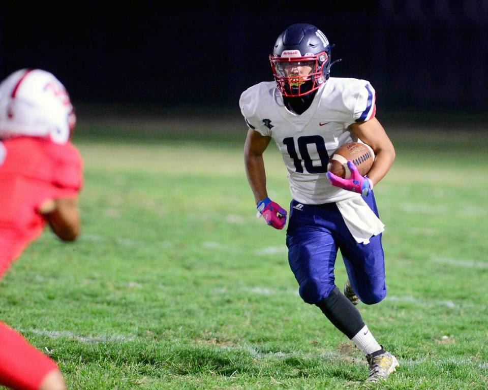 Beyer receiver Nathan Dip eyes a defender after making a catch during a game between Ceres and Beyer at Ceres High School in Ceres California on September 22, 2023.