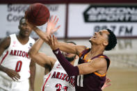 Arizona State guard Alonzo Verge Jr. (11) drives past Arizona guard Terrell Brown Jr. during the first half of an NCAA college basketball game Thursday, Jan. 21, 2021, in Tempe, Ariz. (AP Photo/Rick Scuteri)