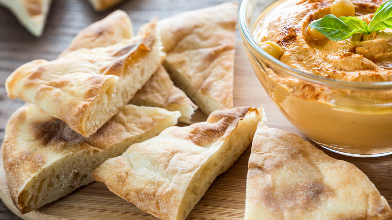 Bread near bowl of hummus