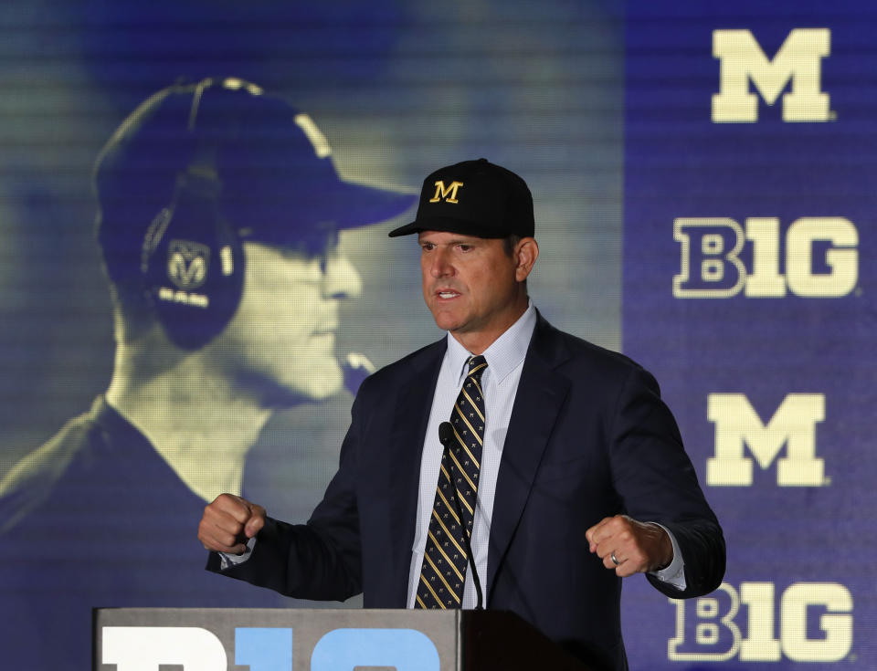 Michigan head coach Jim Harbaugh responds to a question during the Big Ten Conference NCAA college football media days Friday, July 19, 2019, in Chicago. (AP Photo/Charles Rex Arbogast)